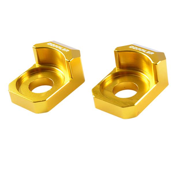 Grandinės įtempėjas MOTO aliuminis CNC DOPPLER, skirtas RIEJU MRT PRO/XPS/XP7/XR7/NK7, auksinis (2 vnt.).